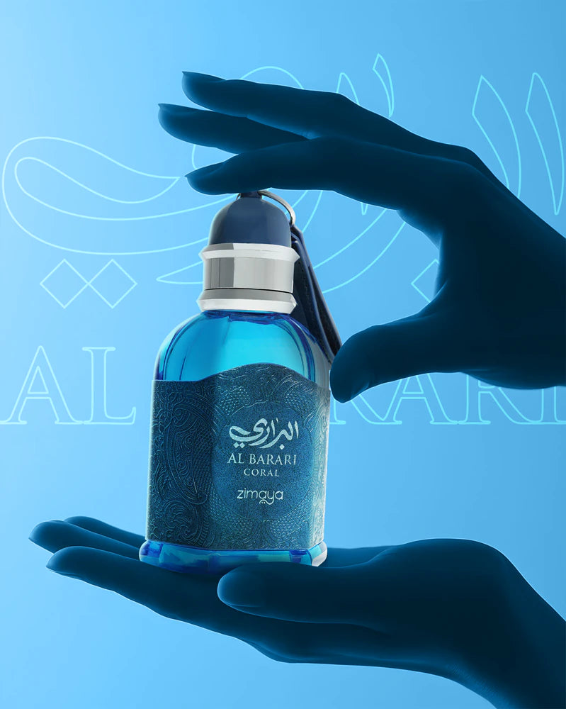 Hand holding a blue Al Barari perfume bottle against a blue background