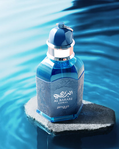 Blue perfume bottle on a rock with water in the background