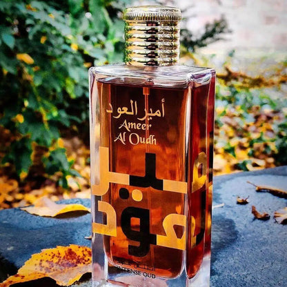 Ameer Al Oudh Intense Oud fragrance – bottle among autumn leaves