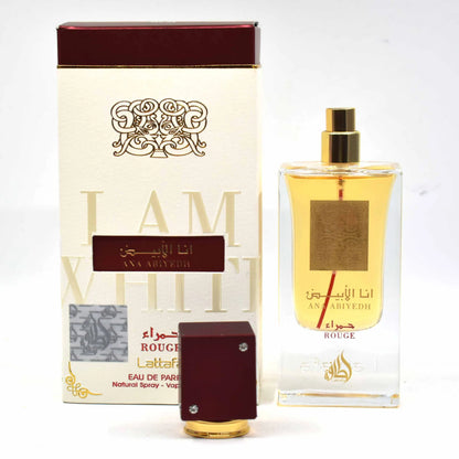 Ana Abiyedh Rouge fragrance – box and bottle with artistic text backdrop