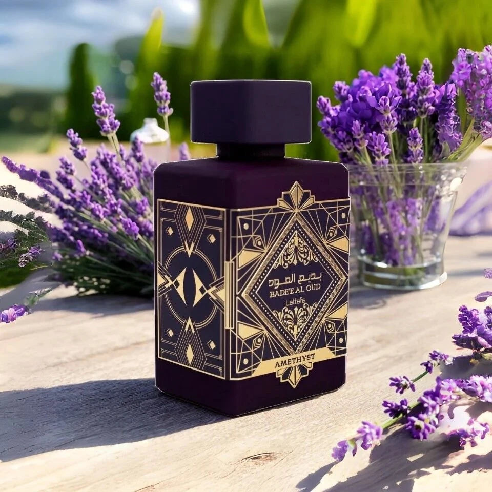 Badee Al Oud Amethyst fragrance – bottle with lavender flowers outdoor lifestyle