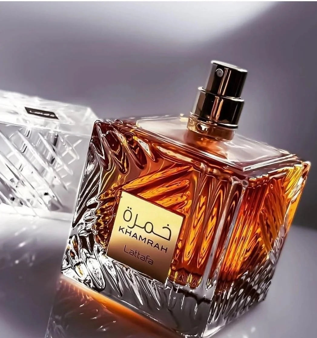 Khamrah fragrance – bottle close-up in amber dramatic lighting