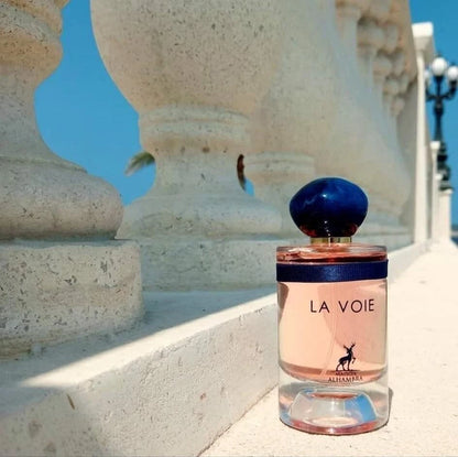 La Voie 100ml fragrance – bottle on stone surface with blue sky