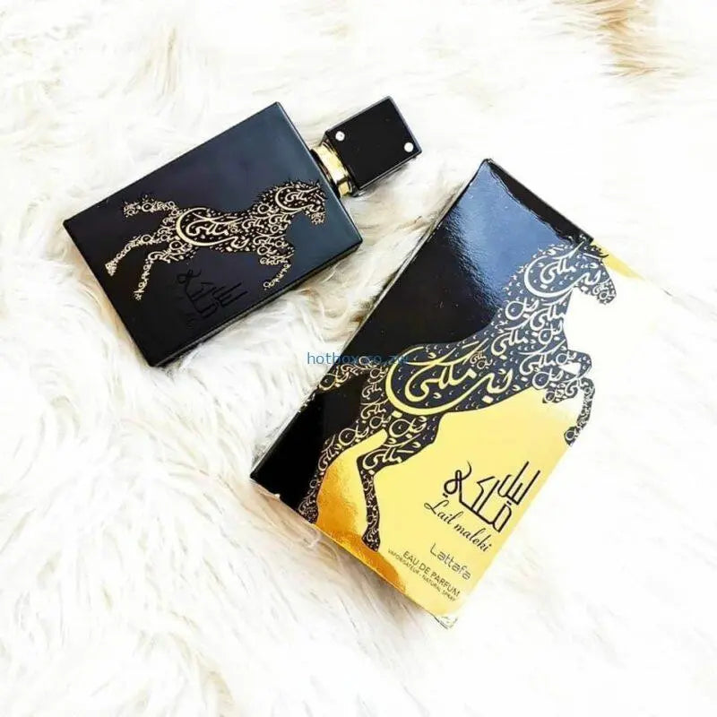 Lail Maleki 100ml fragrance – two bottles on white fur flat lay